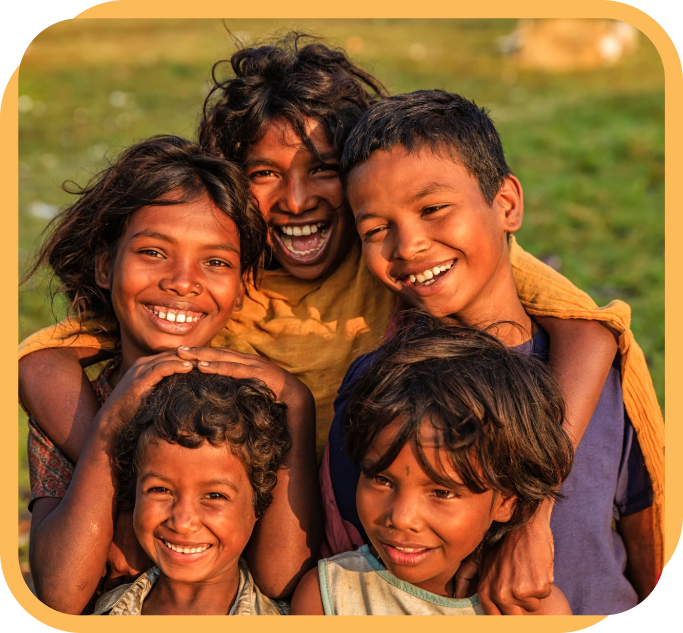 Smiling children in a sunny field