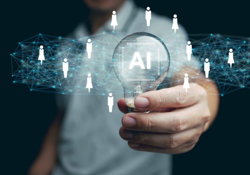 AI technology for HR, Human resources. A man holds lightbulb with artificial intelligence chip in it representing using Ai and automation to manage and recruit employees. Automate the hiring process