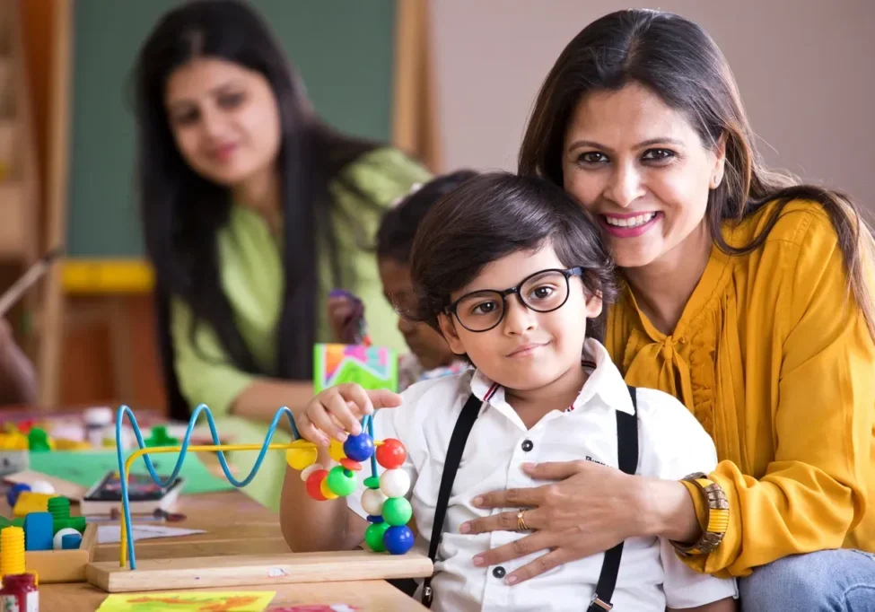 Smiling woman with child at school